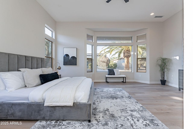 bedroom featuring light hardwood / wood-style floors and ceiling fan