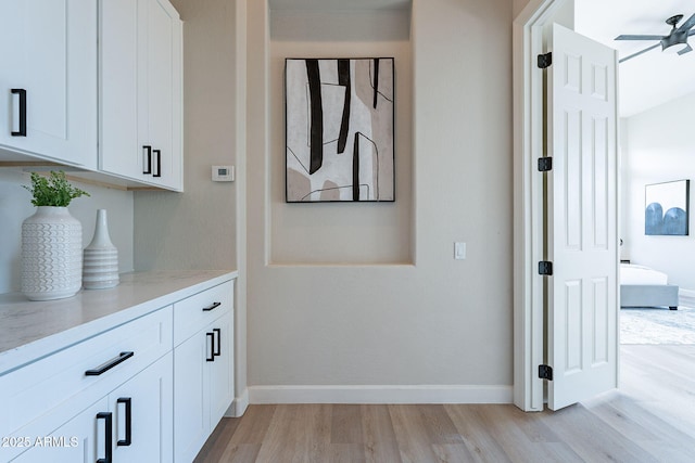 hall with light hardwood / wood-style flooring