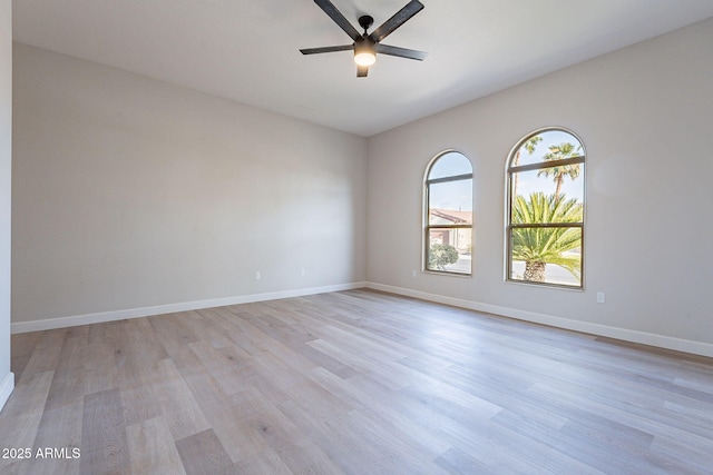 spare room featuring ceiling fan and light hardwood / wood-style floors