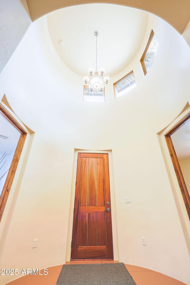 6754 E Roberto Loop, Hereford, AZ 85615 - entrance foyer with a towering ceiling and a chandelier