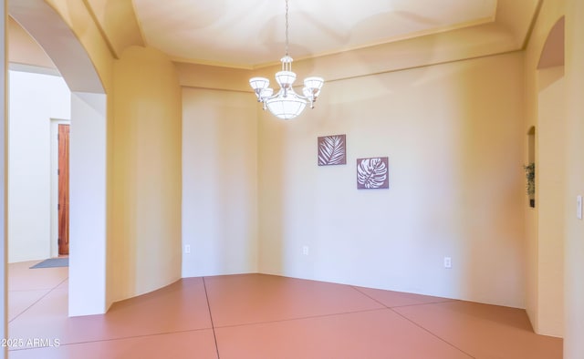 6754 E Roberto Loop, Hereford, AZ 85615 - empty room with arched walkways and a chandelier