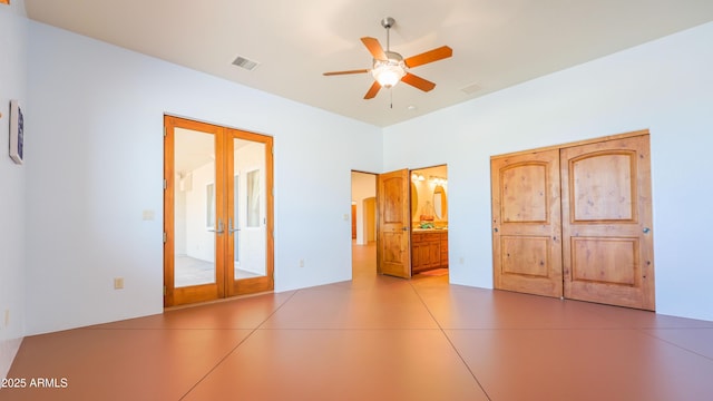 6754 E Roberto Loop, Hereford, AZ 85615 - unfurnished bedroom with french doors, connected bathroom, and a ceiling fan