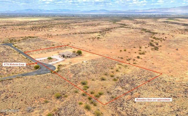 6754 E Roberto Loop, Hereford, AZ 85615 - view of rural area featuring property parcel outlined, a mountain backdrop, and a desert landscape