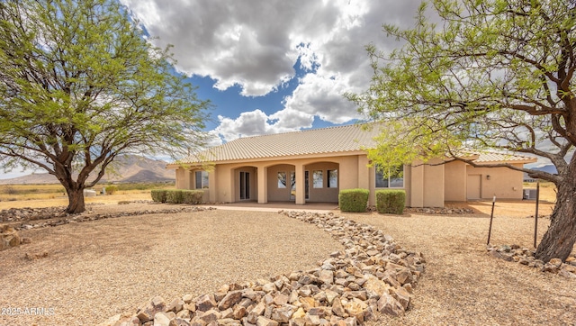 6754 E Roberto Loop, Hereford, AZ 85615 - mediterranean / spanish home featuring stucco siding, a tile roof, and covered porch