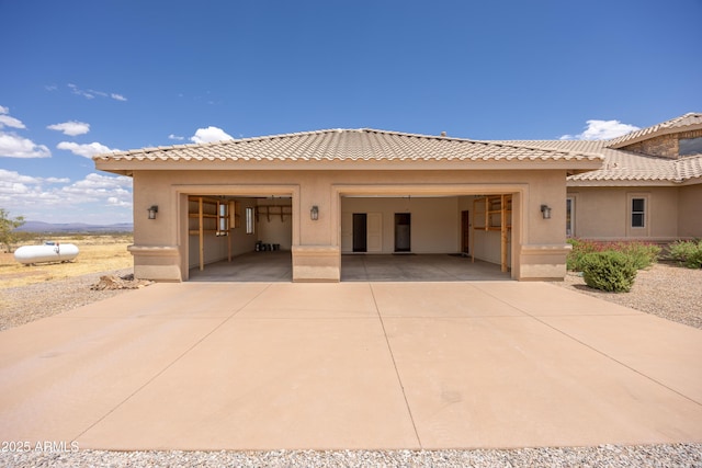 6754 E Roberto Loop, Hereford, AZ 85615 - view of front of house featuring stucco siding, concrete driveway, and a tiled roof