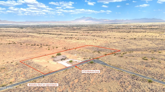 6754 E Roberto Loop, Hereford, AZ 85615 - aerial view of sparsely populated area featuring mountains, a desert landscape, and property parcel outlined