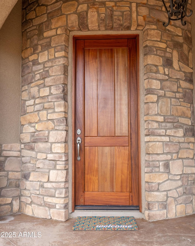 6754 E Roberto Loop, Hereford, AZ 85615 - doorway to property featuring stone siding
