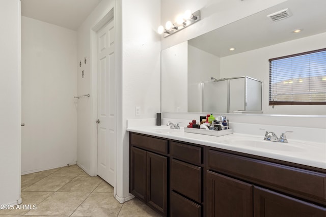 676 N 156th Ln, Goodyear, AZ 85338 - full bathroom featuring double vanity, a sink, visible vents, and tile patterned floors