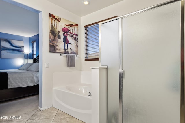676 N 156th Ln, Goodyear, AZ 85338 - ensuite bathroom with a stall shower, connected bathroom, a bath, and tile patterned floors