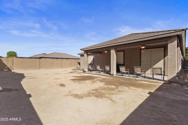 676 N 156th Ln, Goodyear, AZ 85338 - exterior space featuring a patio area, a fenced backyard, and stucco siding