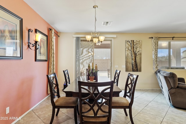 676 N 156th Ln, Goodyear, AZ 85338 - dining room featuring baseboards, visible vents, a chandelier, and light tile patterned flooring