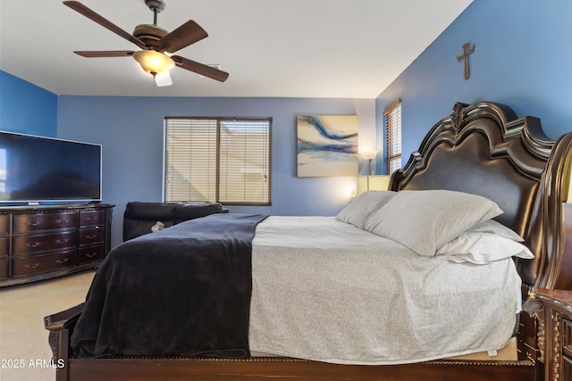 676 N 156th Ln, Goodyear, AZ 85338 - bedroom featuring ceiling fan, multiple windows, and carpet flooring