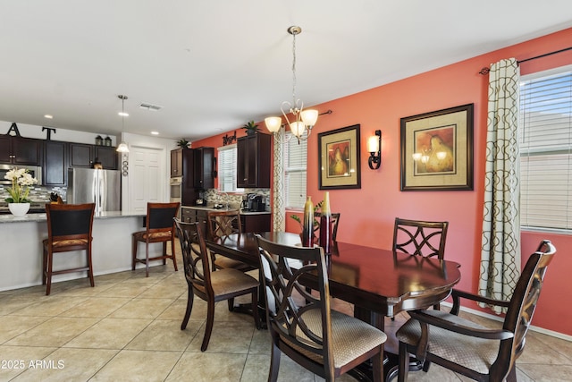 676 N 156th Ln, Goodyear, AZ 85338 - dining room with light tile patterned floors, recessed lighting, visible vents, and an inviting chandelier