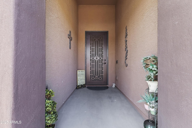 676 N 156th Ln, Goodyear, AZ 85338 - doorway to property featuring stucco siding