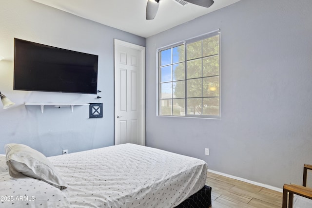 676 N 156th Ln, Goodyear, AZ 85338 - bedroom with light wood-style flooring, baseboards, and ceiling fan