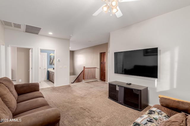 living room featuring light carpet and ceiling fan