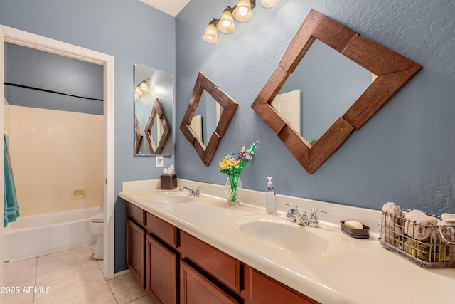 full bathroom with shower / tub combination, vanity, toilet, and tile patterned flooring