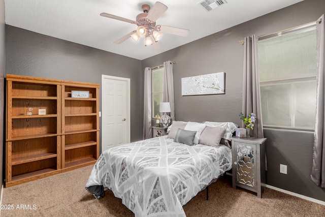 carpeted bedroom with ceiling fan