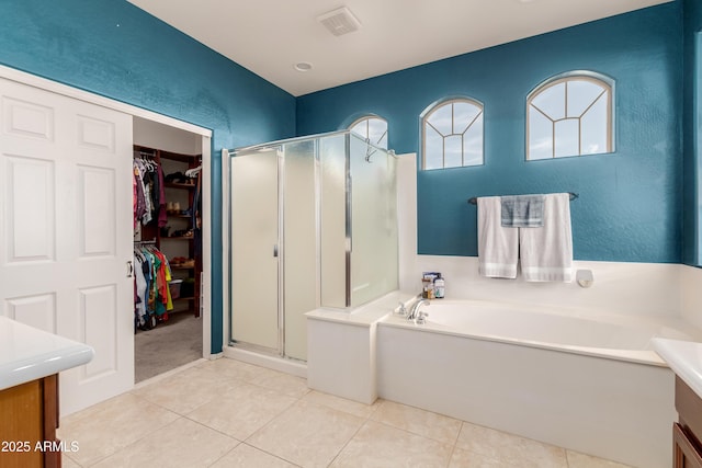 bathroom featuring vanity, separate shower and tub, and tile patterned floors