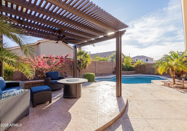 view of patio featuring a fenced in pool, an outdoor living space with a fire pit, ceiling fan, and a pergola