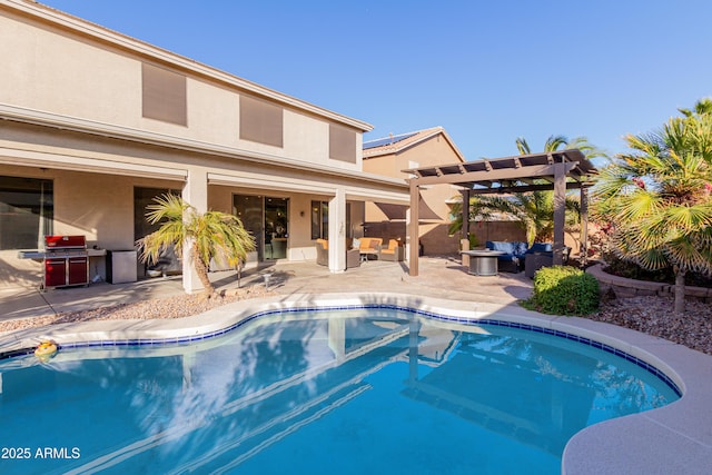 view of swimming pool featuring a patio, a grill, an outdoor hangout area, and a pergola