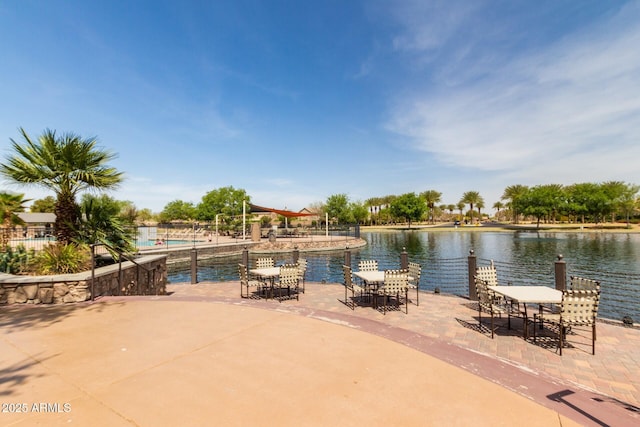 view of patio with a water view