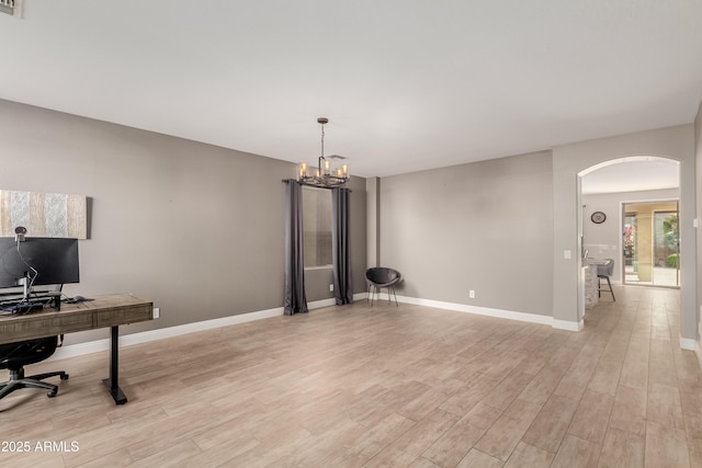 office area featuring a chandelier and light hardwood / wood-style flooring