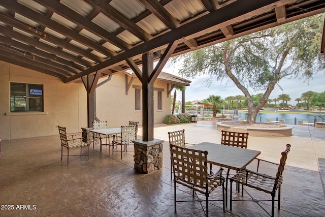 view of patio with a water view