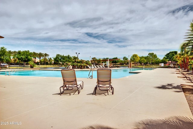 view of pool featuring a patio