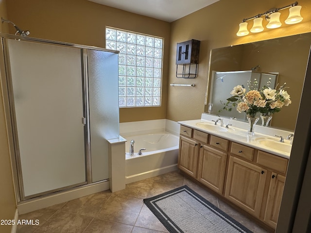 full bathroom with a stall shower, a sink, and a bath