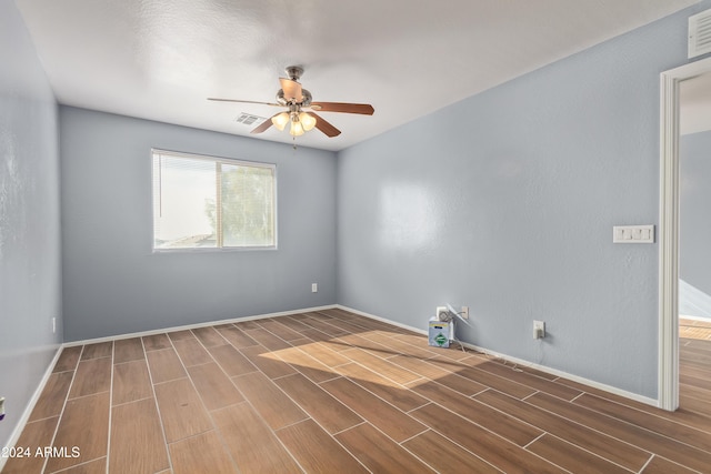 empty room featuring ceiling fan and wood-type flooring