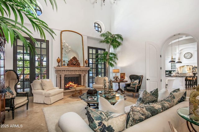 living room with a towering ceiling