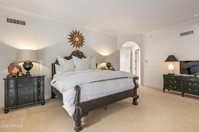 bedroom featuring ornamental molding and light carpet