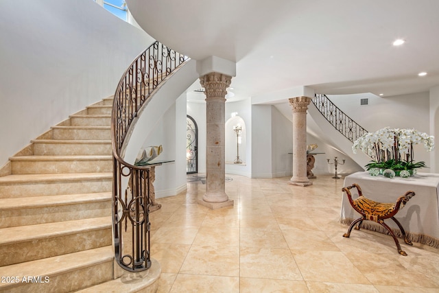 entrance foyer featuring decorative columns