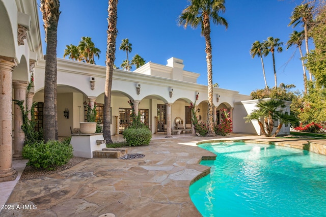 view of swimming pool with a patio