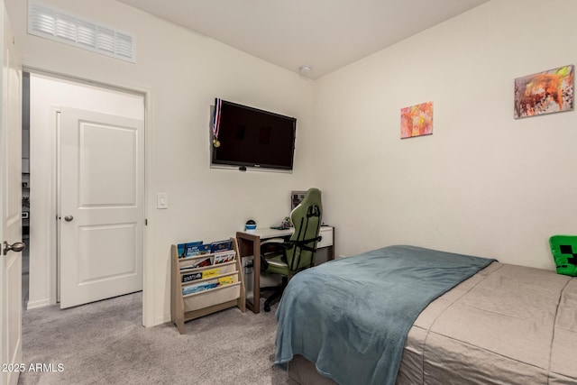 bedroom featuring light carpet