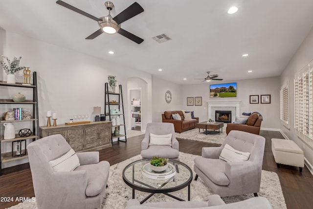 living room with dark hardwood / wood-style floors and ceiling fan