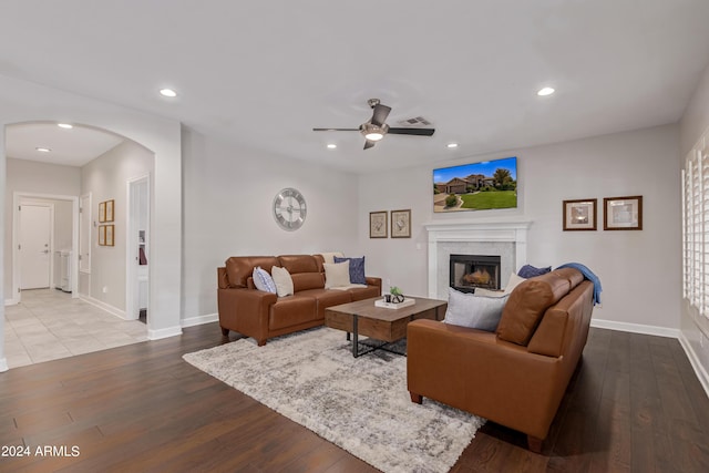 living room with hardwood / wood-style floors and ceiling fan