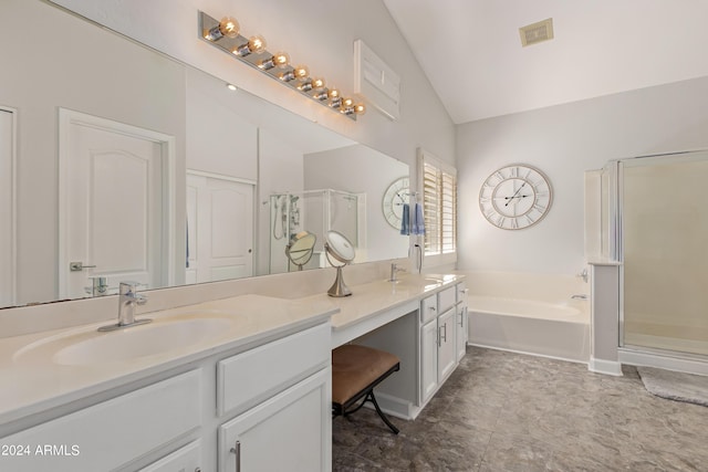 bathroom with lofted ceiling, vanity, and shower with separate bathtub