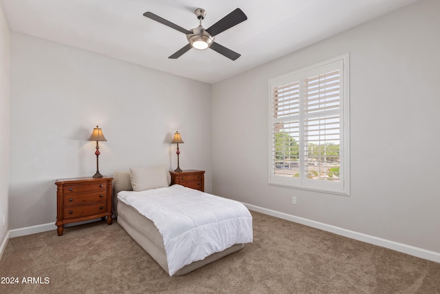 carpeted bedroom featuring ceiling fan