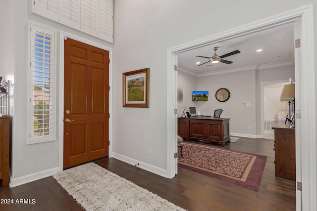 entryway with crown molding, ceiling fan, and dark hardwood / wood-style flooring