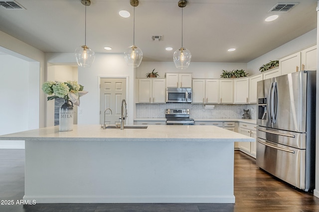 10925 E Toluca Ave, Mesa, AZ 85212 - kitchen with appliances with stainless steel finishes, a sink, recessed lighting, and white cabinetry