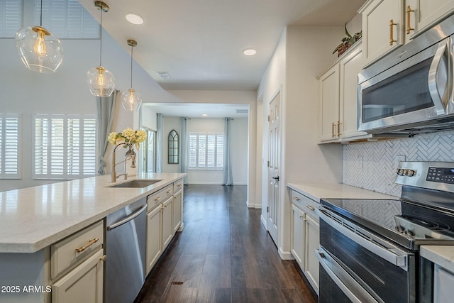 10925 E Toluca Ave, Mesa, AZ 85212 - kitchen featuring stainless steel appliances, a sink, backsplash, light countertops, and dark wood-type flooring