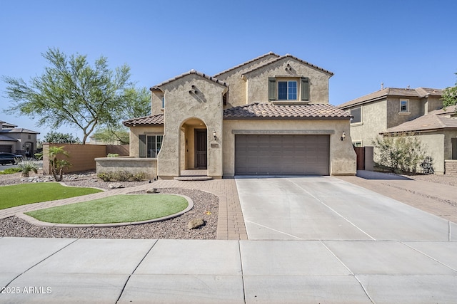 10925 E Toluca Ave, Mesa, AZ 85212 - mediterranean / spanish-style home with a tile roof, concrete driveway, stucco siding, and an attached garage