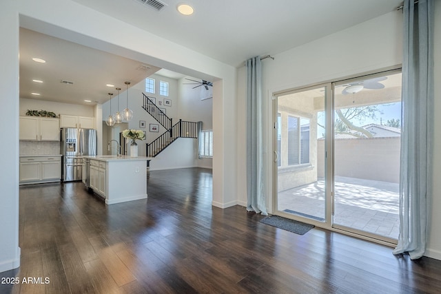 10925 E Toluca Ave, Mesa, AZ 85212 - kitchen featuring stainless steel fridge with ice dispenser, ceiling fan, dark wood-type flooring, white cabinets, and recessed lighting