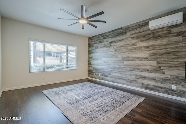10925 E Toluca Ave, Mesa, AZ 85212 - empty room with an accent wall, a wall mounted AC, a ceiling fan, baseboards, and wood finished floors