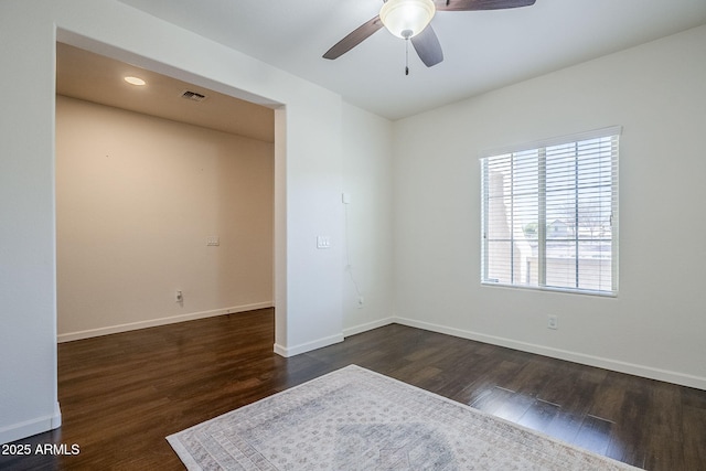 10925 E Toluca Ave, Mesa, AZ 85212 - empty room with ceiling fan, dark wood-type flooring, and baseboards