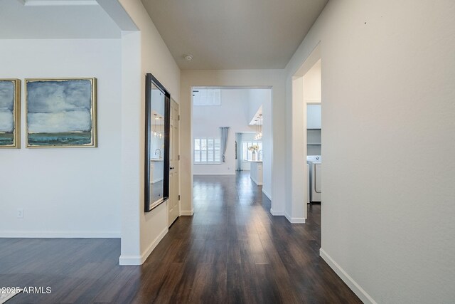 10925 E Toluca Ave, Mesa, AZ 85212 - corridor with dark wood-style flooring, washer / dryer, and baseboards