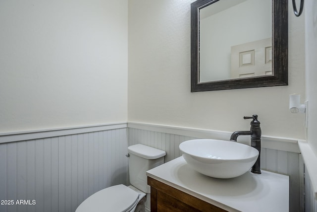 10925 E Toluca Ave, Mesa, AZ 85212 - half bathroom with wainscoting, vanity, and toilet