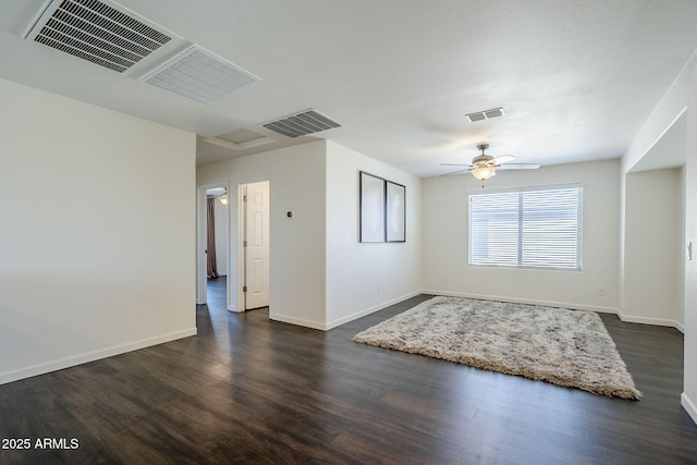 10925 E Toluca Ave, Mesa, AZ 85212 - empty room featuring dark wood-style floors, baseboards, and a ceiling fan